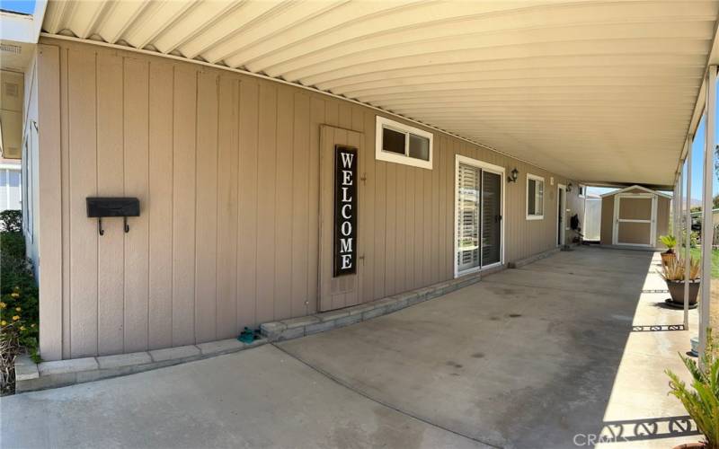 Covered carport with additional private stoarge