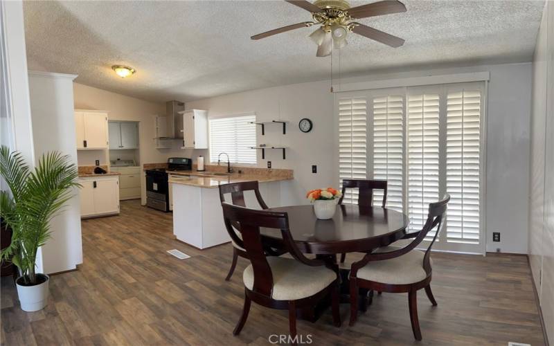 Dining room area with ceiling fans throughout