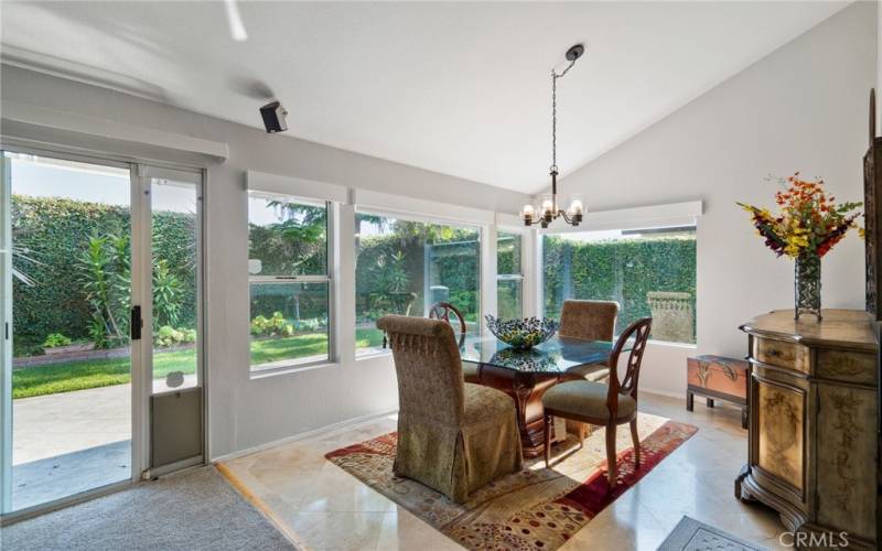Formal Dining Room highlighted with garden views.