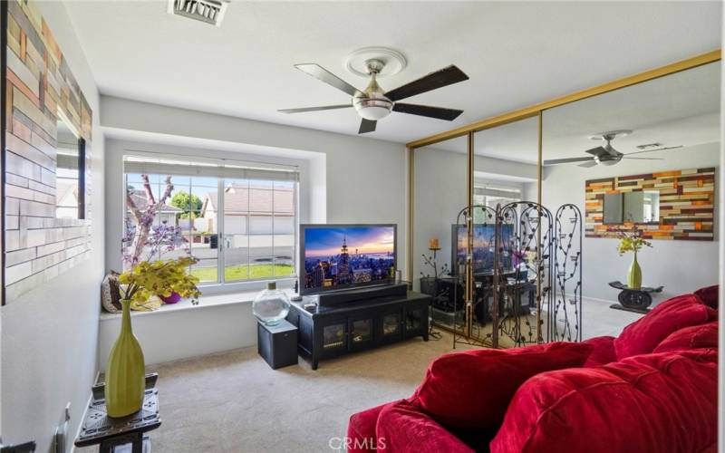 The secondary bedrooms on the main floor are nicely finished with window seats and mirrored closet doors.