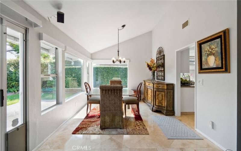 Formal Dining Room highlighted with vaulted ceilings and surrounded by windows for lots of natural light