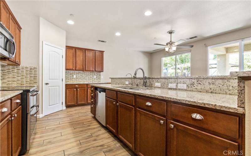 Beautiful Kitchen with lots of granite countertop space, walk-in pantry and roll out drawers