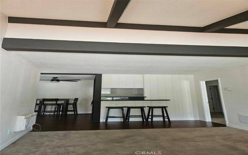 Spacious Living Room with Designer Beams. Peek A Boo feature from the kitchen, perfect for entertaining family and friends