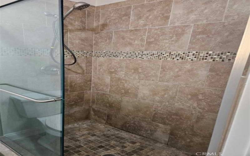 Upgraded Bathroom with Beautiful walk in shower with 1/2 in glass doors