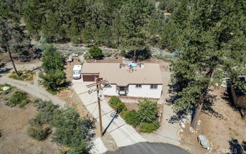 On a cul de sac near Mil Potero Hwy, this home is both accessible and adjacent to the national forest.