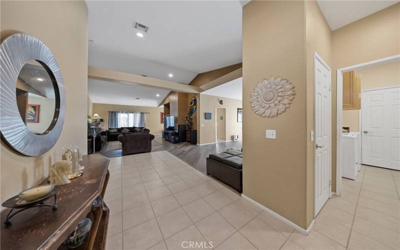 Entry, with Laundry, Hall Closet, & Garage Door to the Right