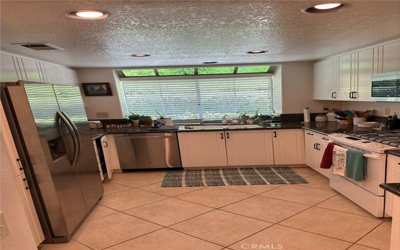 Open kitchen with granite countertops