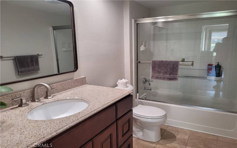 Hallway bathrom tub/shower area with glass doors

Hallway bathroom with glass doors in tub/shower area