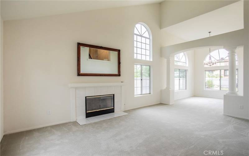 Formal living with columned dining room