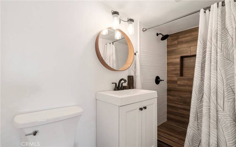 DOWNSTAIRS THIRD LEVEL REMODELED BATHROOM WITH WALK IN SHOWER