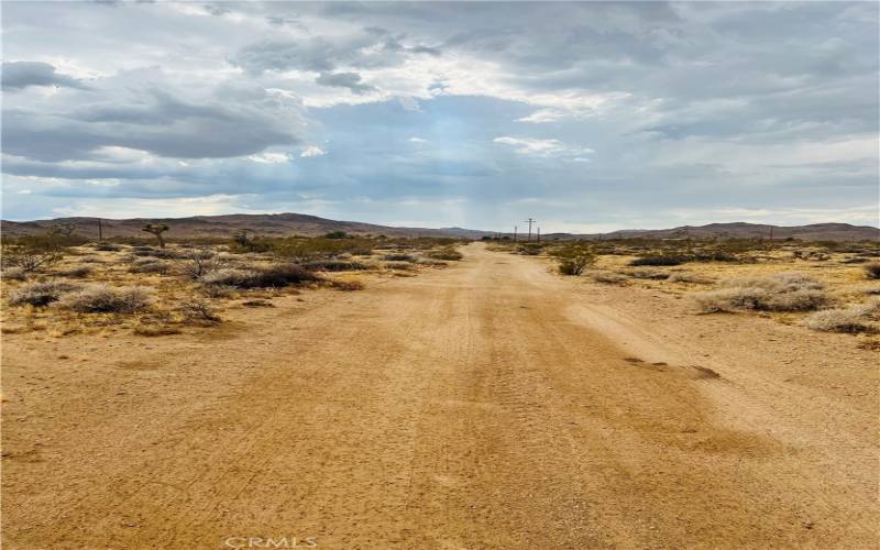 Back of the lot with dirt road access