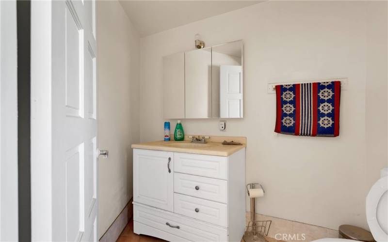 Main home half bath, by family room.