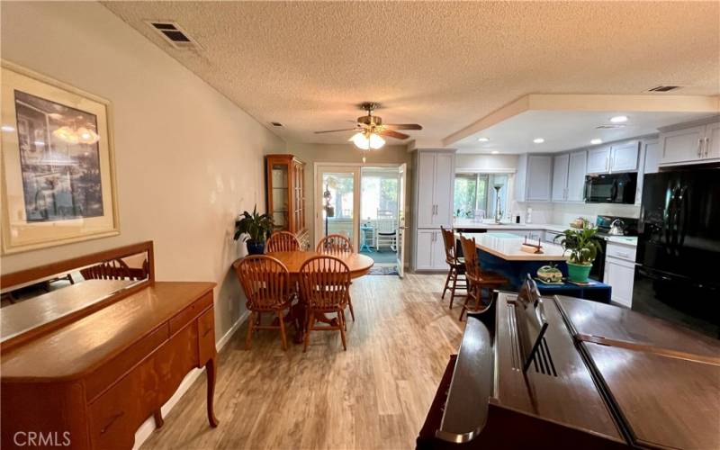 In kitchen dining area + island/breakfast bar.