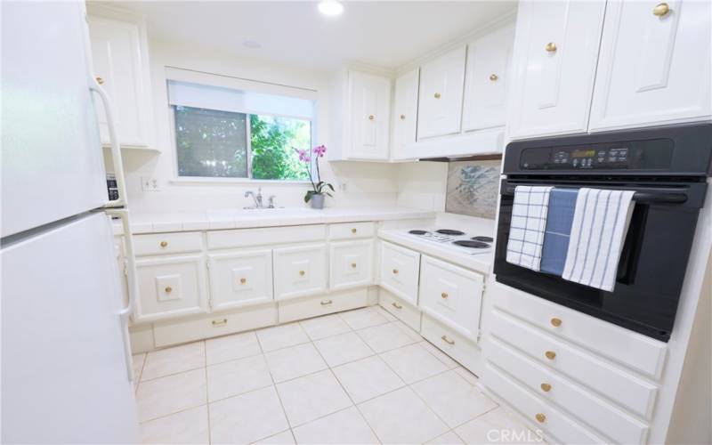 Light, bright kitchen with full window over sink