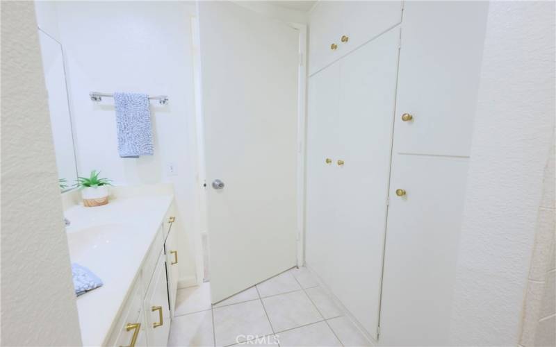 FLoor to ceiling storage closets in bathroom for an abundance of storage space