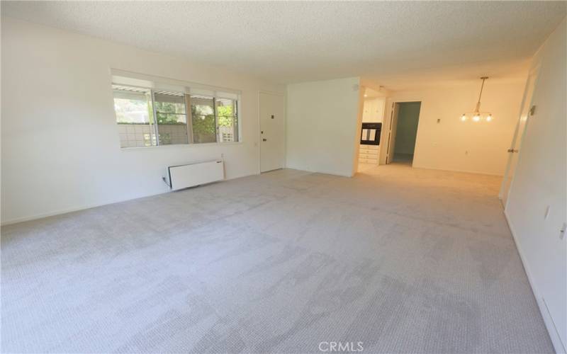 Open concept living aea leading to dining area