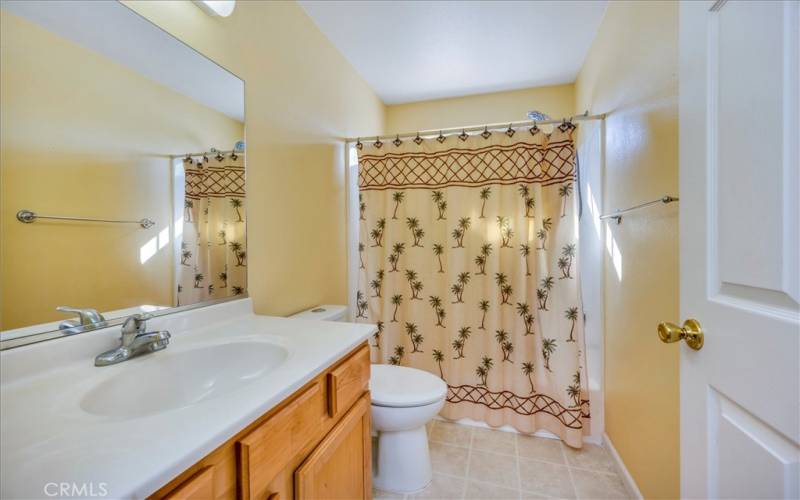 Hall bath, bedrooms open into one angular hallway with bathroom