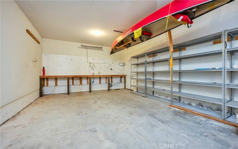 garage looking towards shop area and door to yard. Canoe does not convey