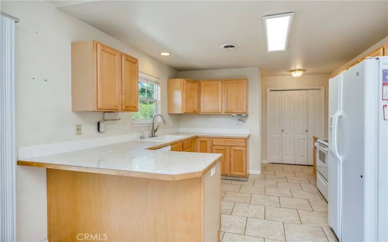 Kitchen, pantry at back, right of pantry is the laundry room