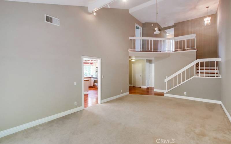 Living area back to stairs and entry