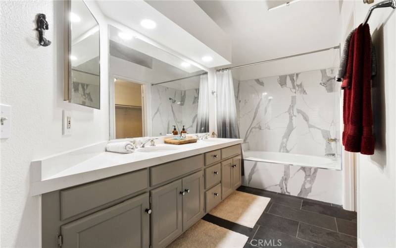 Dual sinks, tub, shower and privacy toilet.
