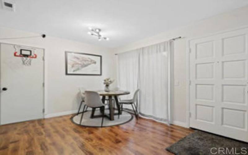 View from Living Room to Dining Room and door to 1-Car Garage