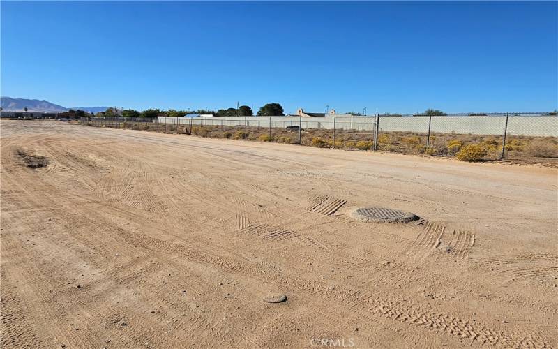 Water and Sewer covers in front of the property.