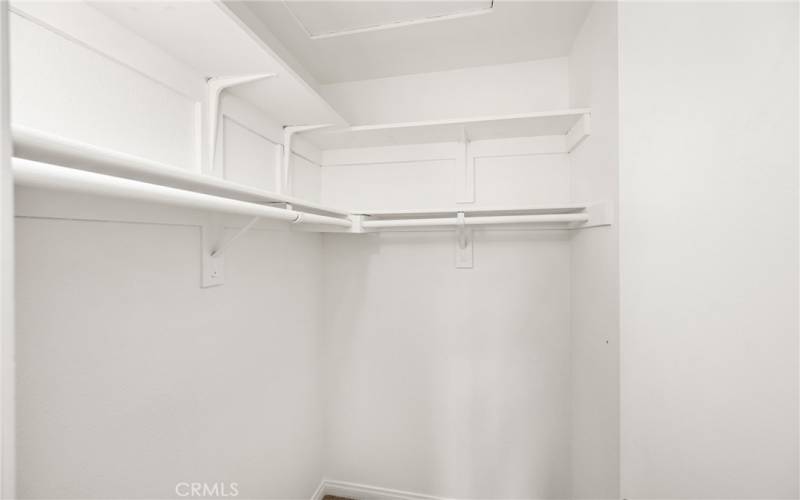 Walk-in closet in one secondary bedroom