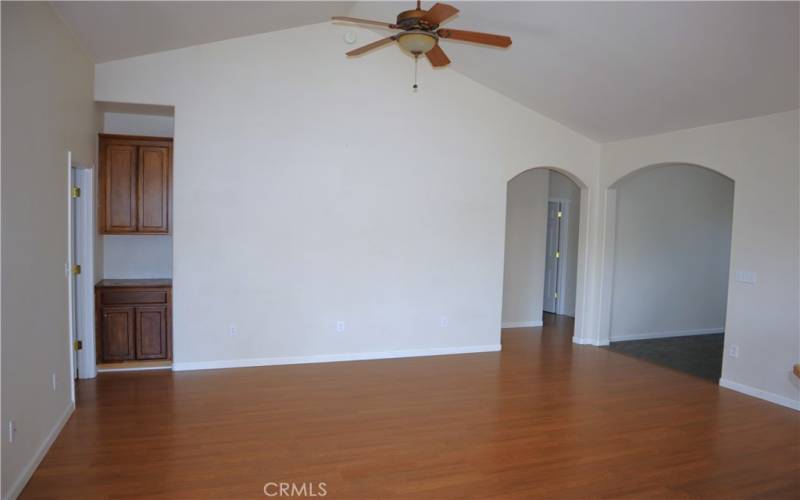 Living room with access to primary bedroom and main hallway