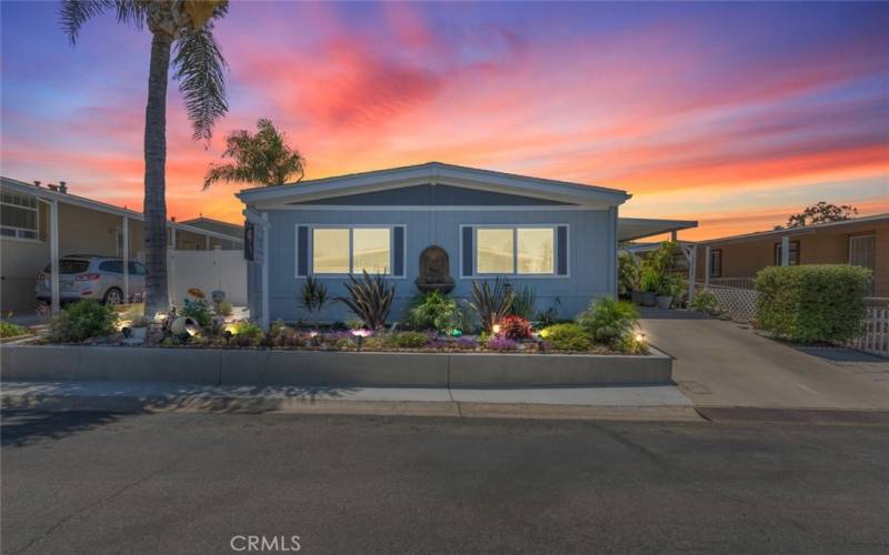 Inviting home with a beautifully landscaped front yard.