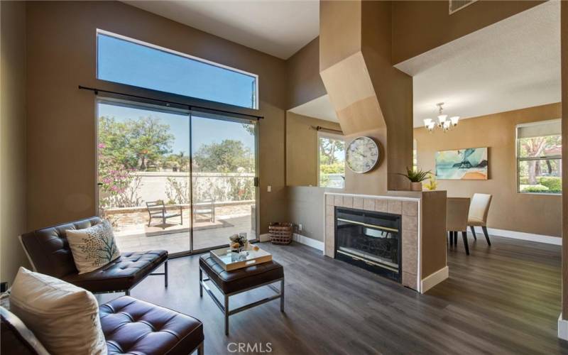 View of Fireplace and Dining Room beyond.