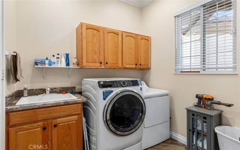 Laundry Room with deep utility sink. Just inside the home from garage