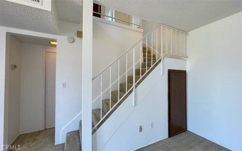 Two storage closets flank the staircase.