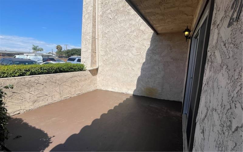 Patio off of the dining room with a sliding door entry into unit.