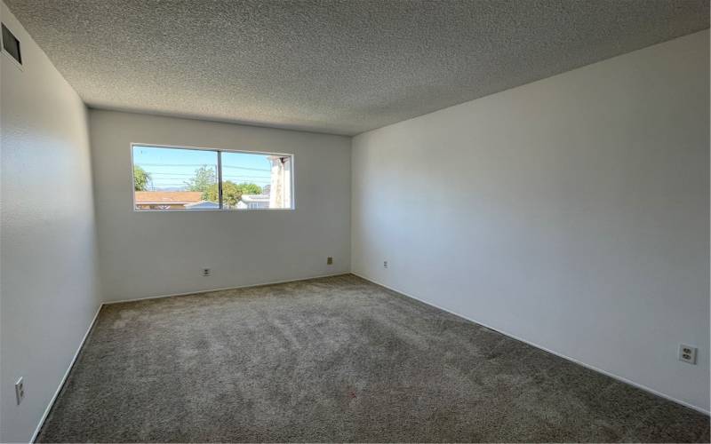 The secondary upstairs bedroom is nearly the same size as the primary bedroom.