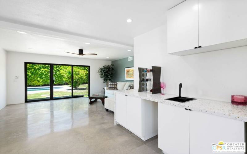 bar area with pop up faucet on sink