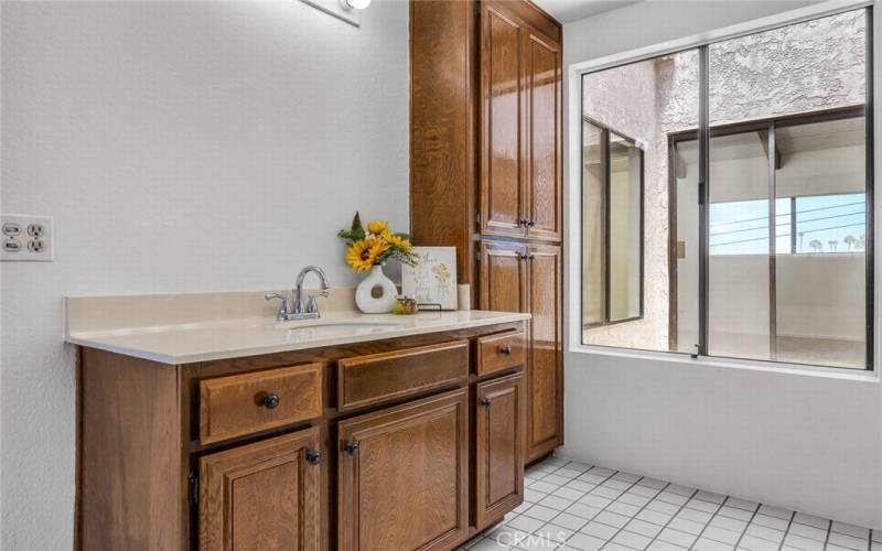 Master Suite 2-Vanity Area with Atrium and Master Suite 1 in Background