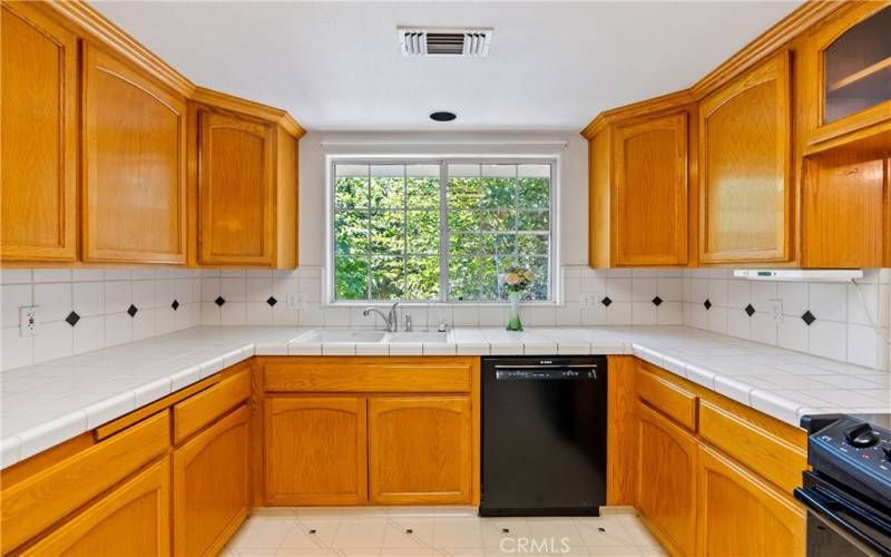 Kitchen with beautiful window facing garden