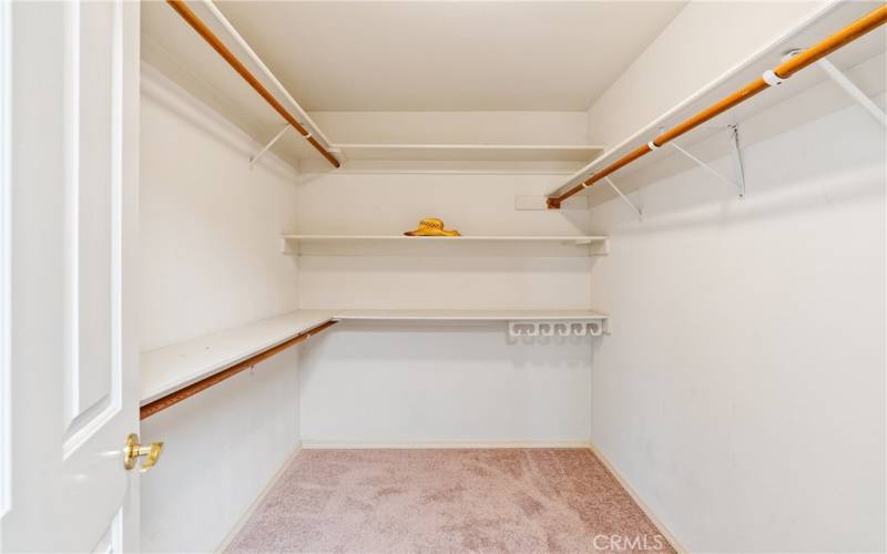 Spacious walk in closet in primary bedroom