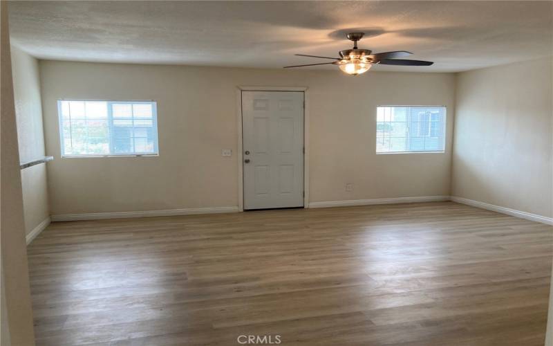 West Unit - Other side of living room, looking towards front door.