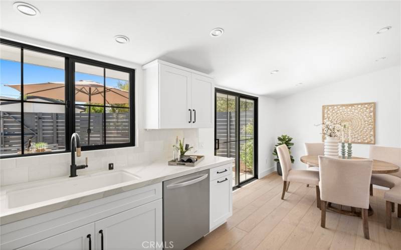 Front house kitchen looks out on back patio