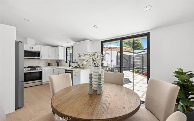 Front house dining opens to back patio