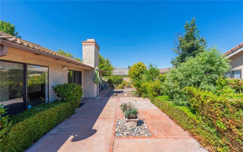 Landscaped Yard off of Living Room and Primary Suite