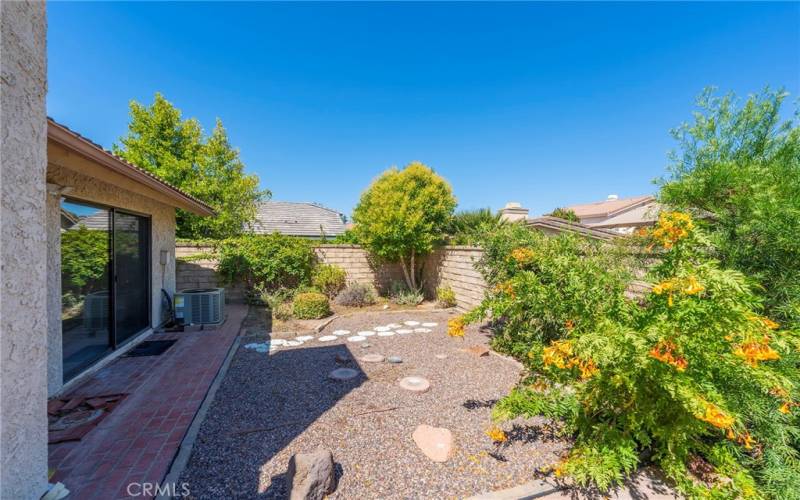 Landscaped Yard off of Living Room and Primary Suite