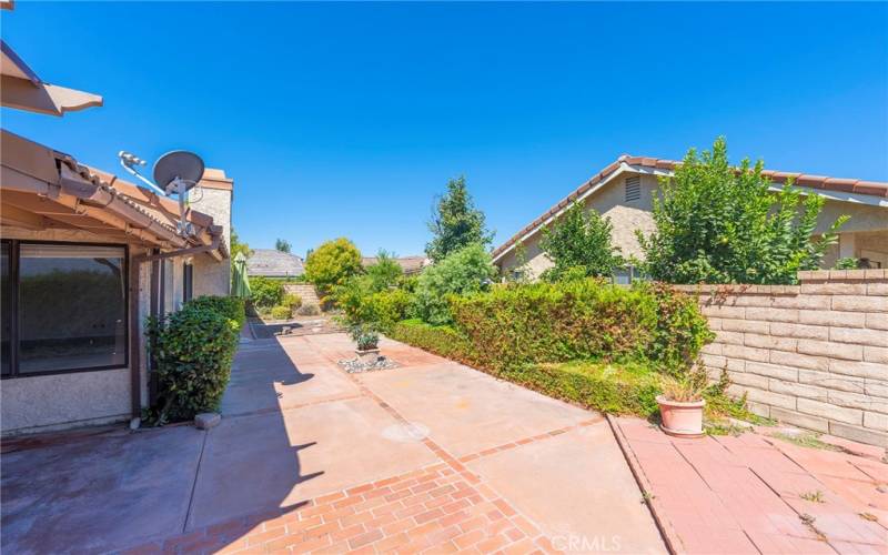 Landscaped Yard off of Living Room and Primary Suite