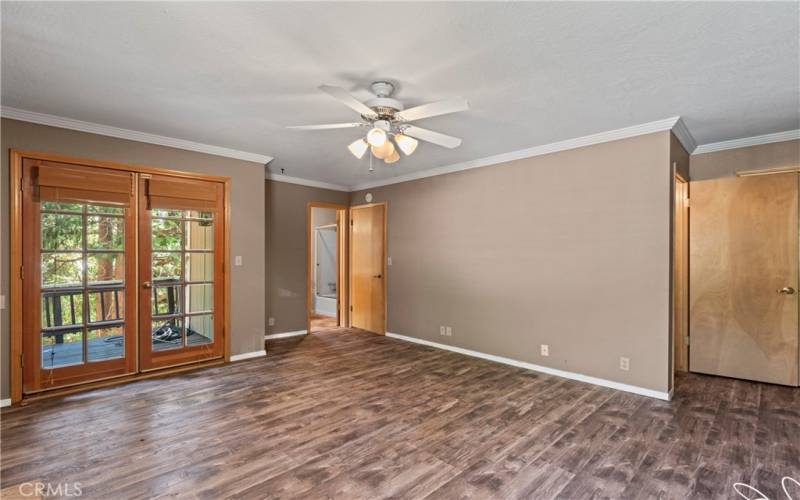 Primery Bedroom showing deck entrance on left, access to lower level  on right