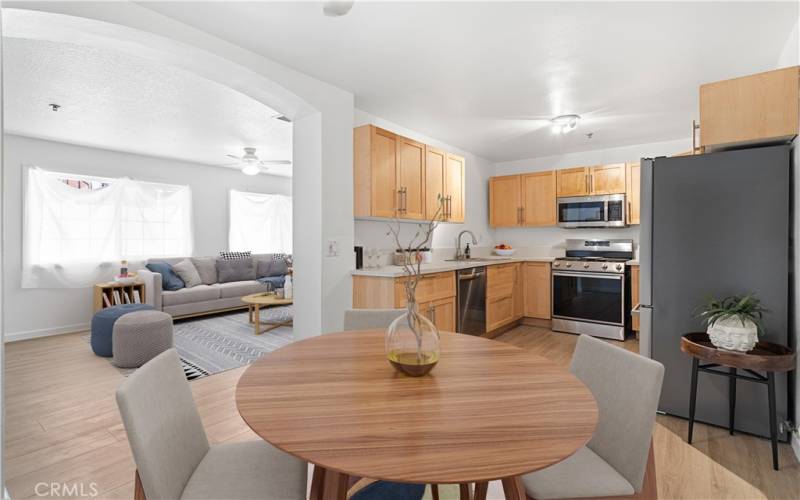 Virtually staged dining area and kitchen