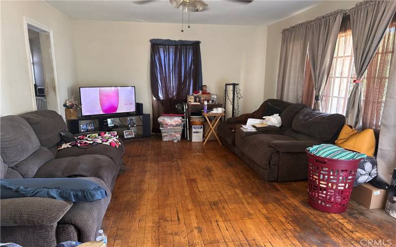 living room showcasing hardwood flooring