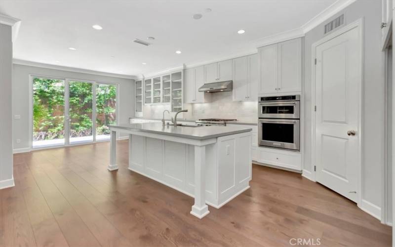 Upgraded Kitchen with luxury sliding doors to private patio