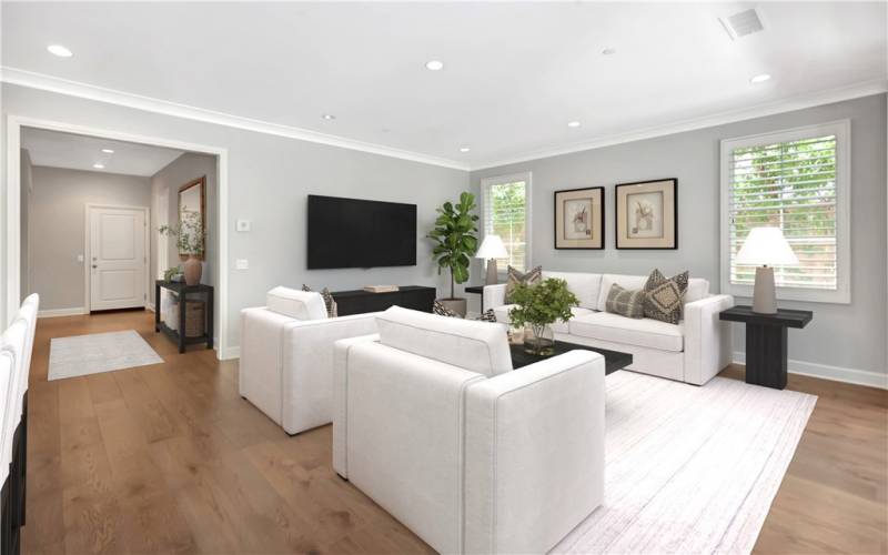 Virtually Staged - Family Room looking toward the entry way